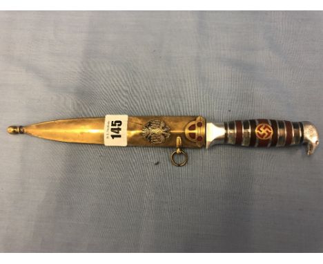 A knife in scabbard with glass eagle head handle and swastika 