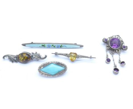 Five brooches including one enamel