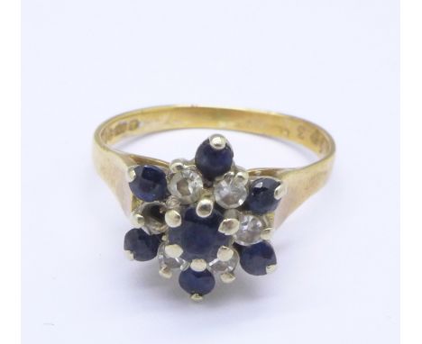 An 18ct gold cluster ring, 3.4g, K, lacking one stone