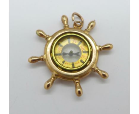 A 9ct gold compass pendant, marked 9ct gold