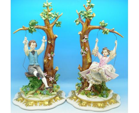 A pair of Capodimonte figures, a girl and a boy playing on swings, girls right leg restored