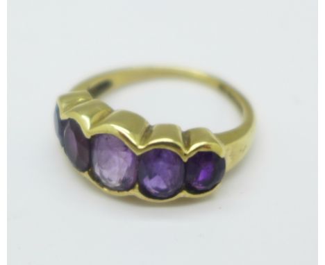 A 9ct gold and five stone amethyst ring, 3.3g, K