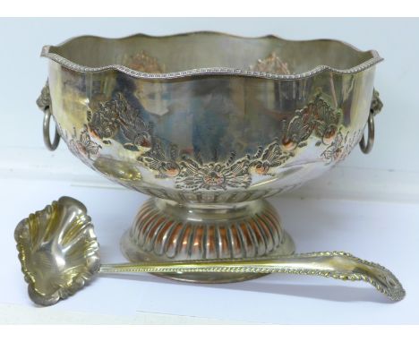 A large plated punch bowl and ladle
