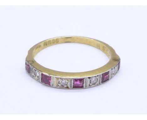 An 18ct gold, diamond and ruby half eternity ring, 2.1g, K