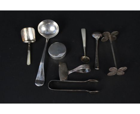A mixed silver lot including mother of pearl handled caddy spoons, cruet spoons, pill pot, ladle, continental knife rest etc