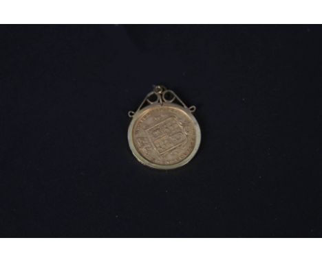 A Victorian shield back half sovereign, 1885 in 9ct gold mount