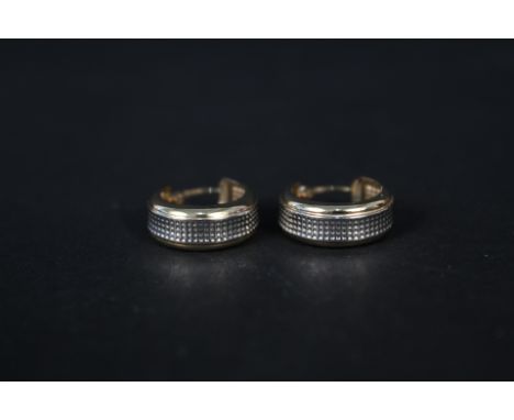 A pair of 14ct gold hoop earrings with studded white gold panel decoration