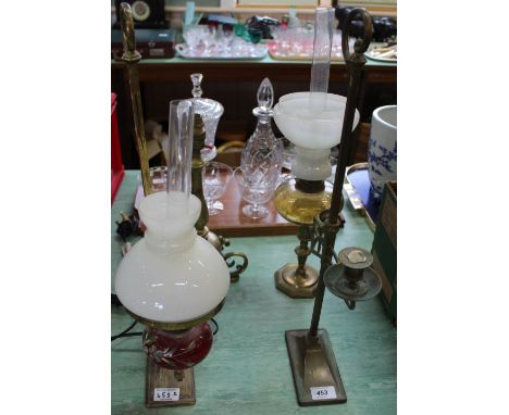 A brass adjustable students lamp plus an adjustable candlestick