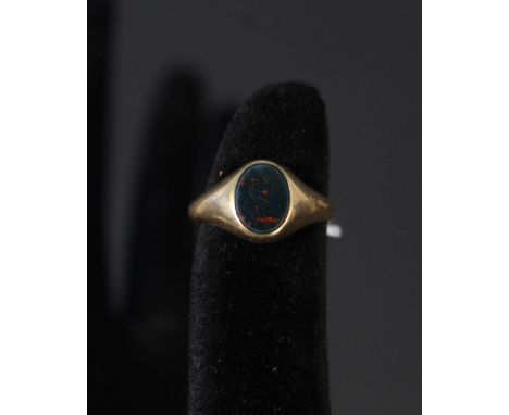 A small 18ct gold gents signet ring set with blood stone, size I