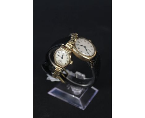 A 9ct gold lady's watch (with presentation inscription to back) together with a gents 9ct gold wristwatch on leather strap
