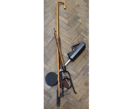 A shooting stick, book jack, shepherds crook, wrought iron poker plus a metal detector