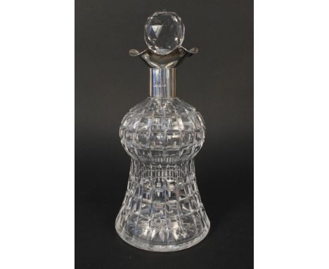 A silver rim cut glass thistle shaped decanter