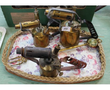 Three brass blow lamps plus a toasting fork