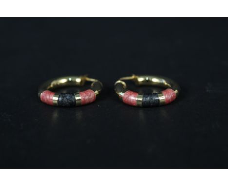 A pair of 14ct gold hoops with pink and black coloured decoration