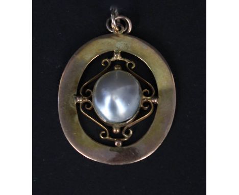 An Edwardian 9ct gold pendant set with large blister pearl