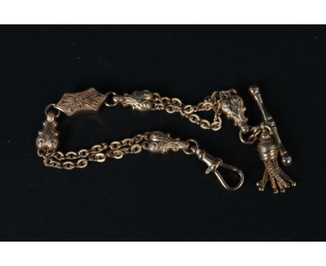 A 9ct rose gold fancy bracelet with T-bar and dog clip ends and tassel drop