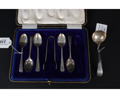 A boxed set of five (of six) teaspoons and matching sugar nips together with a silver sauce ladle