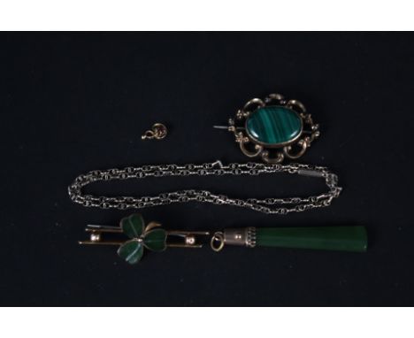 A yellow metal jade set bar brooch, a yellow metal mounted jade pendant, a yellow metal mounted malachite brooch and a yellow
