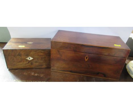 A 19th century rosewood rectangular tea caddy, fitted with two lift out boxes with hinged covers and a central glass bowl, to