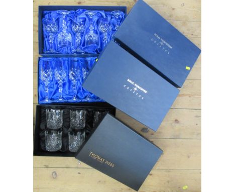 Two Royal Worcester boxed sets of wine glasses, together with a Thomas Webb boxed set of glass tumblers