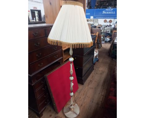 An onyx and metal standard lamp