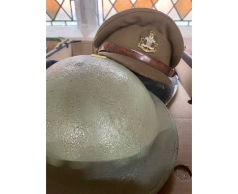A box to include Royal Monmouthshire cap, helmet, shields etc