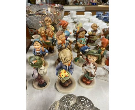 A large collection of Hummel/Goebel figures