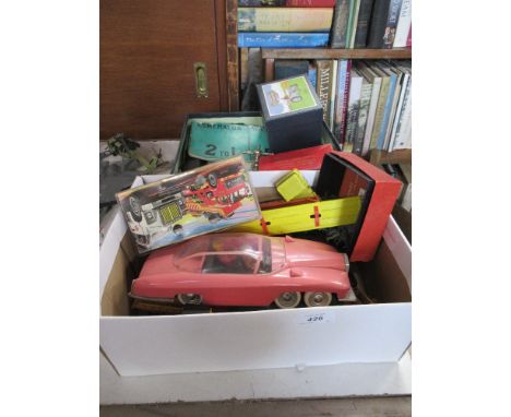 A box of toys including Lady Penelope and a vintage horse game