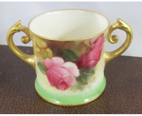 A Royal Worcester two handled mug, decorated with roses, height 2ins