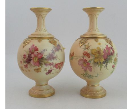 Two Royal Worcester spherical vases, decorated with flowers to a blush ivory ground, shape No 1831, height 10.25ins&nbsp;Cond