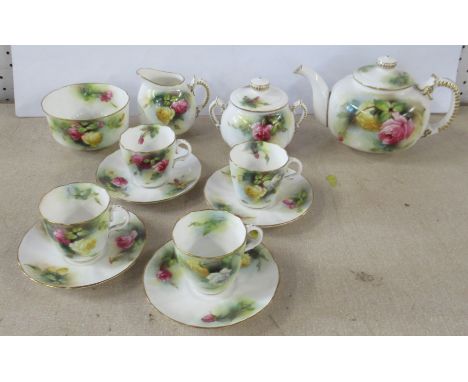 A Royal Worcester coffee set, decorated with rosesCondition Report:  Minor chip to spout of tea pot, the rest of the set appe