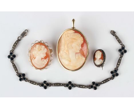 A 9ct gold mounted oval shell cameo pendant brooch, carved as a portrait of a lady, import mark London 1979, length 5cm, anot