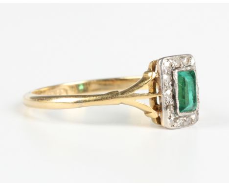 A gold, diamond and green paste set cluster ring, mounted with the rectangular cut green paste within a surround of cushion c