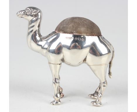 An Edwardian silver novelty pincushion in the form of a standing camel, Birmingham 1905 by Sydney &amp; Co, height 6.5cm.Buye