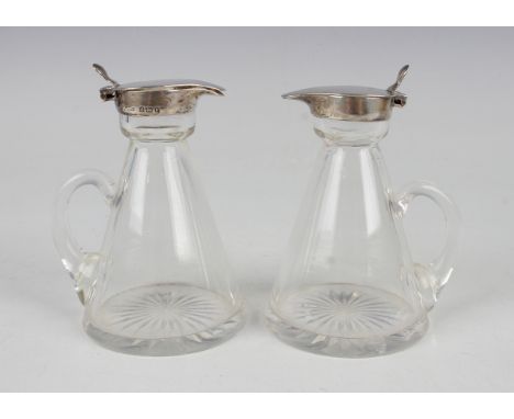 A pair of George V cut glass conical whisky tots with silver collars and tappit lids, Birmingham 1930 by S. Blanckensee &amp;