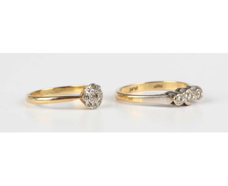 An 18ct gold, platinum and diamond three stone ring, mounted with a row of circular cut diamonds, London 1964, ring size appr