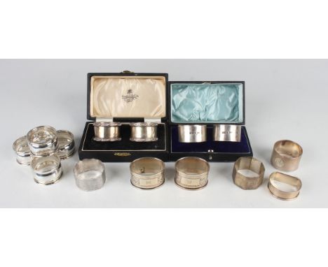 A pair of George VI silver napkin rings with cast Celtic style decoration, Birmingham 1937 and 1938, cased, and a group of ot