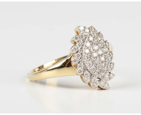 A Tomas Rae 18ct gold and diamond ring in a spiral oval cluster design, mounted with circular cut diamonds, Birmingham 2020, 