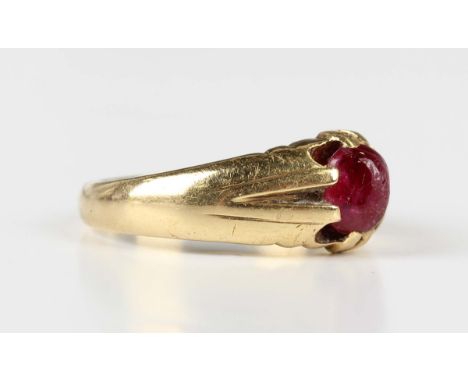 A gold and cabochon ruby solitaire ring, detailed '18ct', weight 8.2g, ring size approx W.Buyer’s Premium 29.4% (including VA