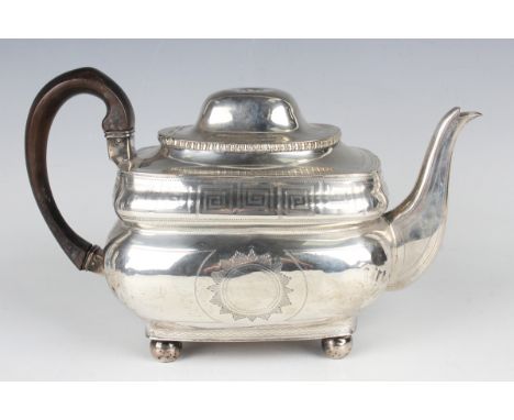 A George III Irish silver cushion shaped teapot, engraved with Greek key banded decoration, Dublin 1809, weight 830.4g, lengt