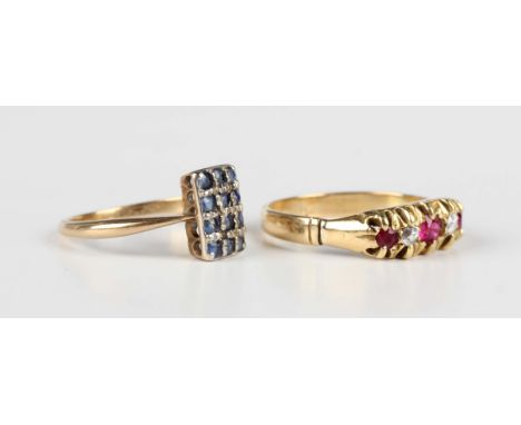 A gold and sapphire rectangular panel shaped ring, mounted with three rows of four circular cut sapphires, indistinct mark, w