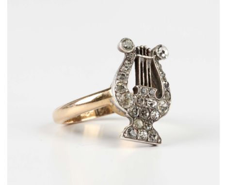 A Swedish gold, silver and colourless paste ring with a lyre motif, the shank inscribed within, detailed '18K', weight 7.1g, 