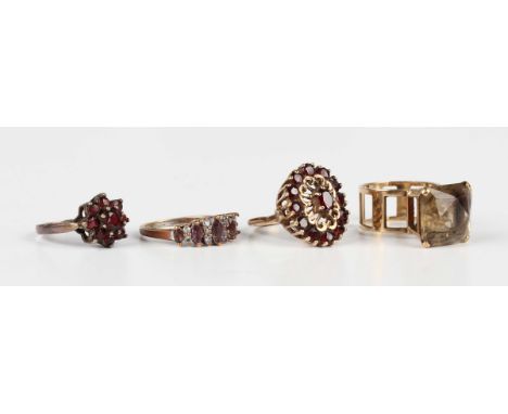 A 9ct gold and garnet oval cluster ring, London 1972, ring size approx N, a 9ct gold ring, claw set with a square cut smoky q