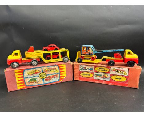 Two boxed Wells-Brimtoy tinplate clockwork models, Crane Transporter with grab, no. 617 and a Car Transporter no. 709.