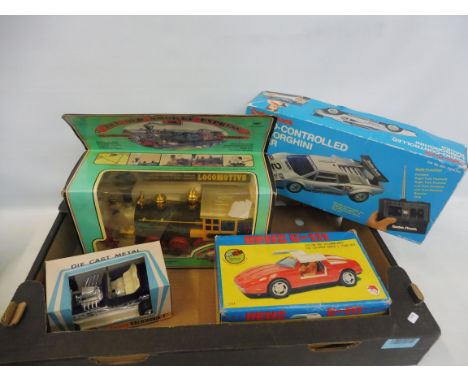 A tray of mixed vintage toys including Old Smokey Express, a Japanese car etc. 