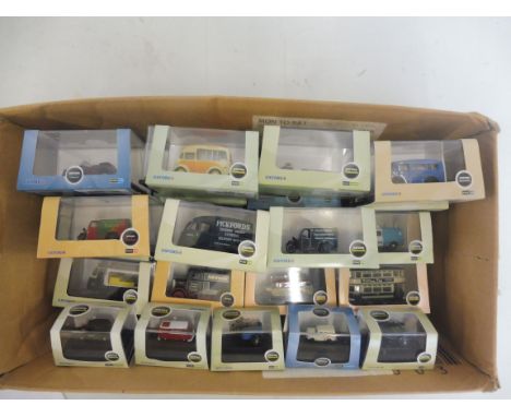 A good selection of Oxford die-cast, HO scale plastic vehicles and vans. 