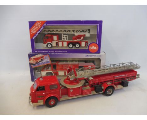 Two Siku fire tenders plus a large scale loose American tender. 