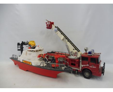 Two large scale rescue models: a fire tender and a coast guard. 