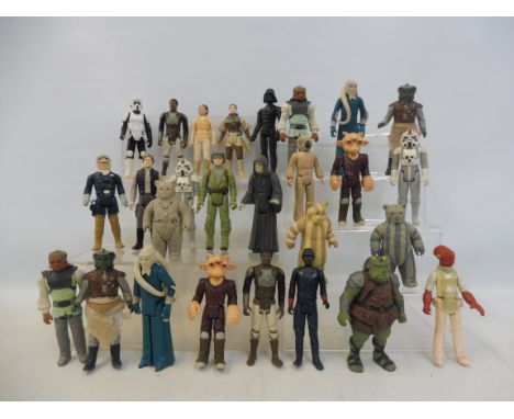 27 vintage Star Wars figures including Hans Solo, Darth Vader and others. 