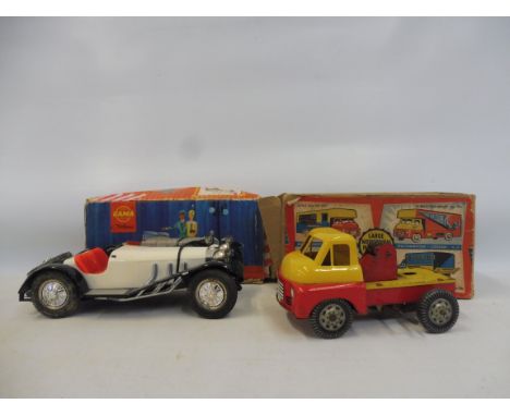 A Made in Great Britain pull-along toy and a Gama Oldtimer boxed classic vehicle, made in West Germany. 